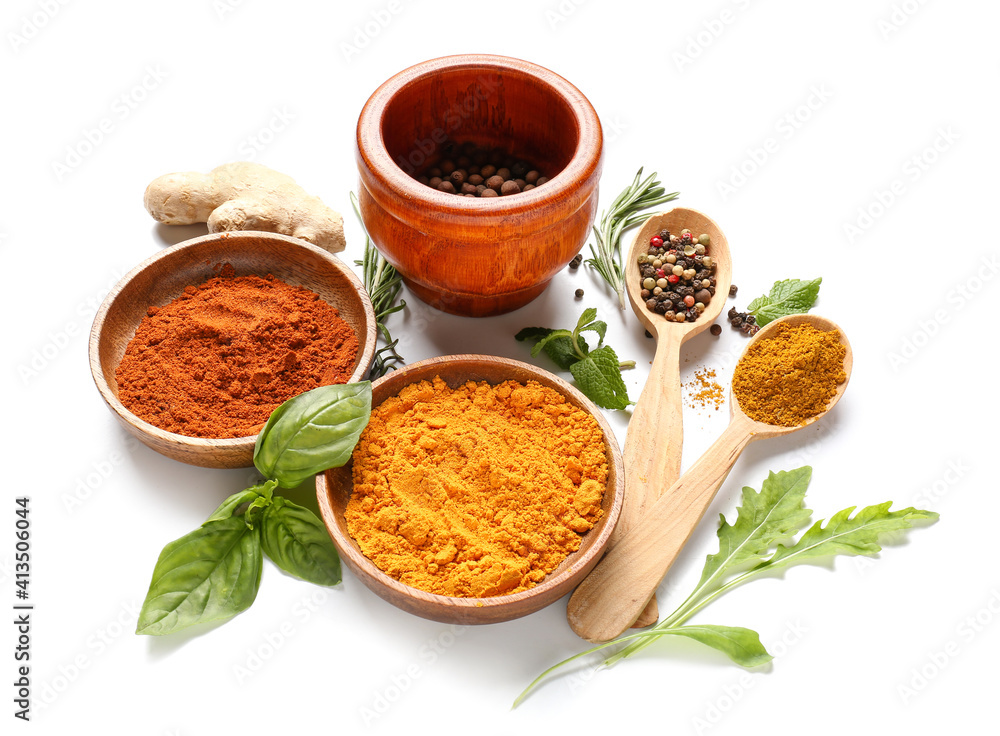 Bowls with different spices and herbs on white background