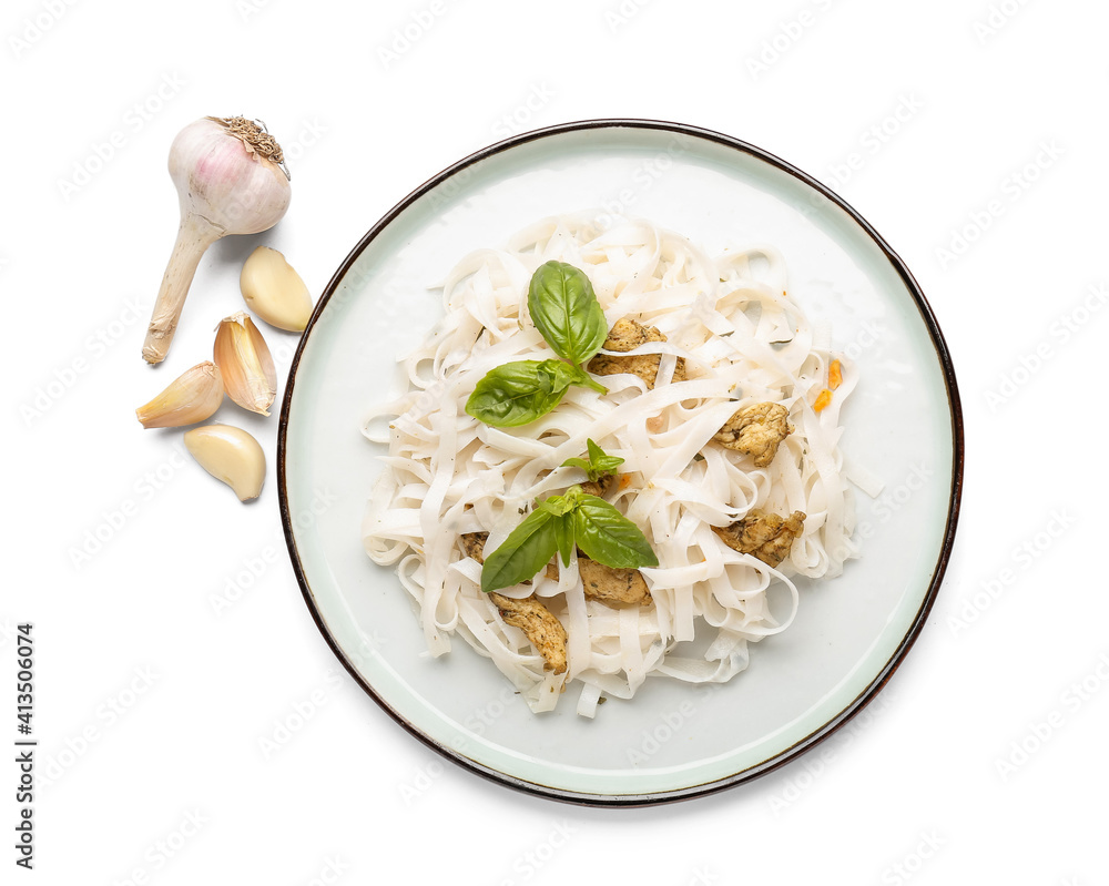 Plate with tasty noodles, chicken and garlic on white background