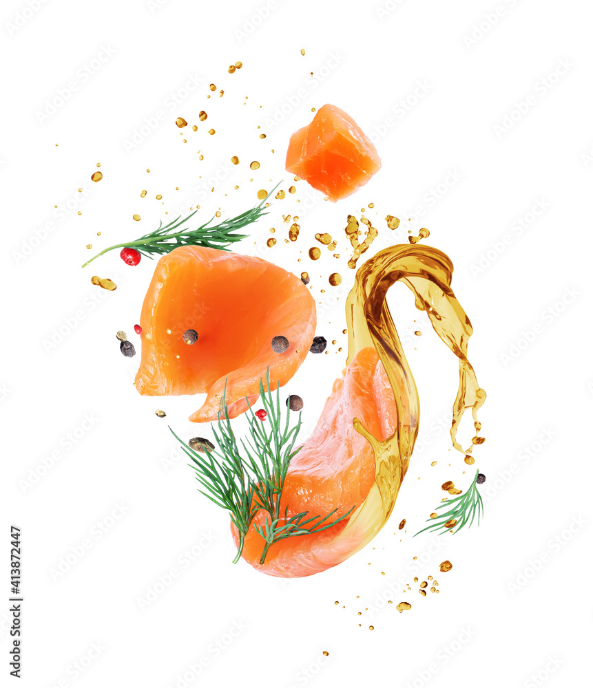 Slices of fresh red fish and flavored spices with a splash of oil close-up, isolated on a white back