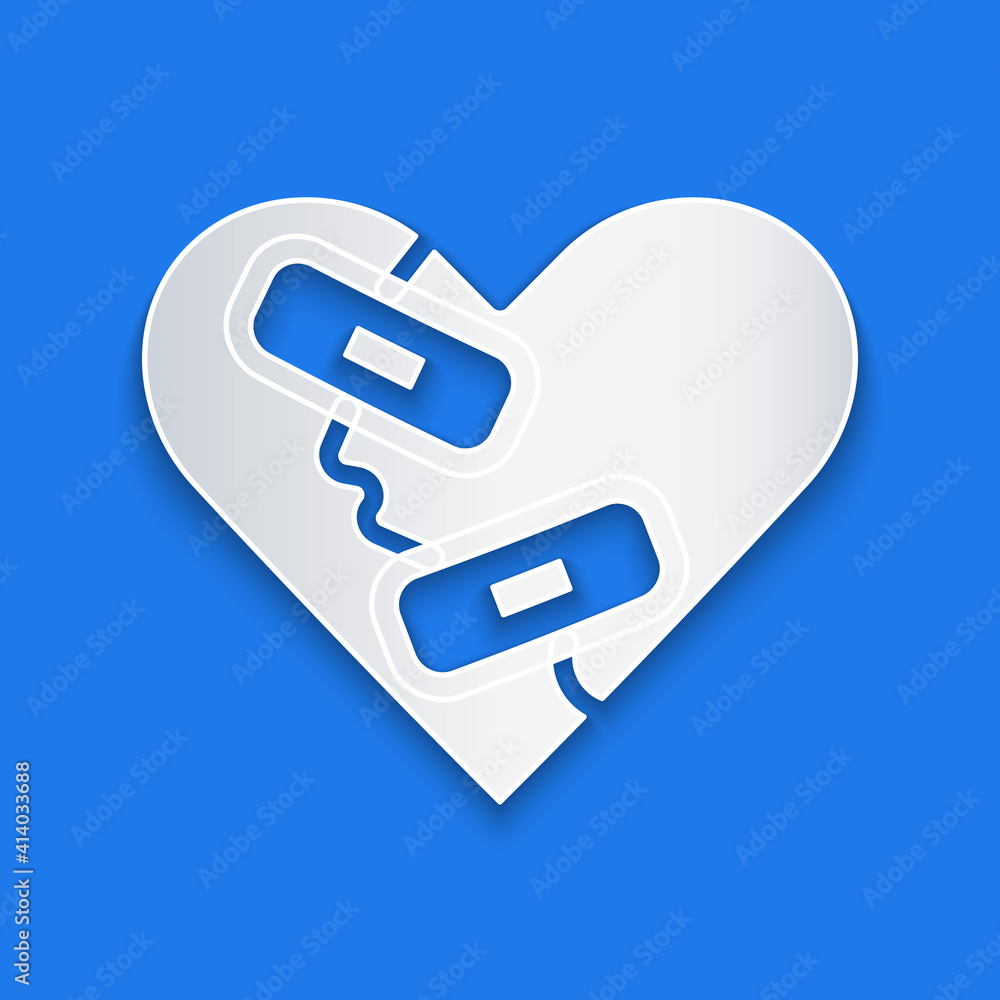 Paper cut Healed broken heart or divorce icon isolated on blue background. Shattered and patched hea