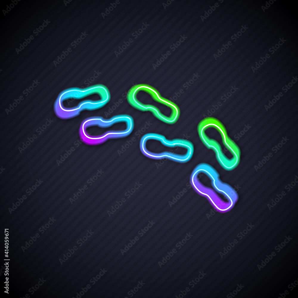 Glowing neon line Human footprints shoes icon isolated on black background. Shoes sole. Vector.