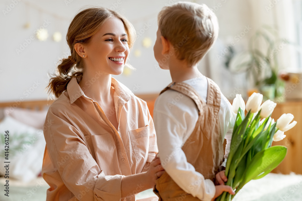 Grateful mother with bouquet thanks son