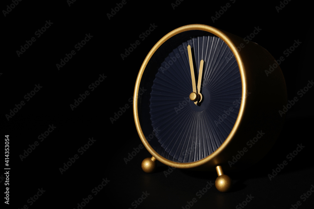 Alarm clock on black background