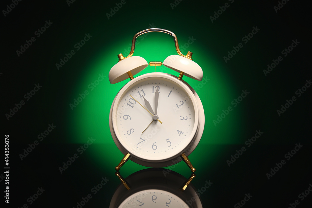 Alarm clock on black background