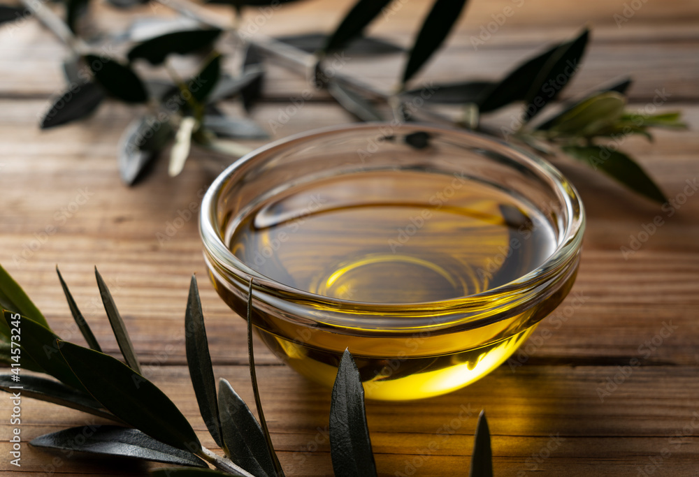 Olive oil on a wooden background