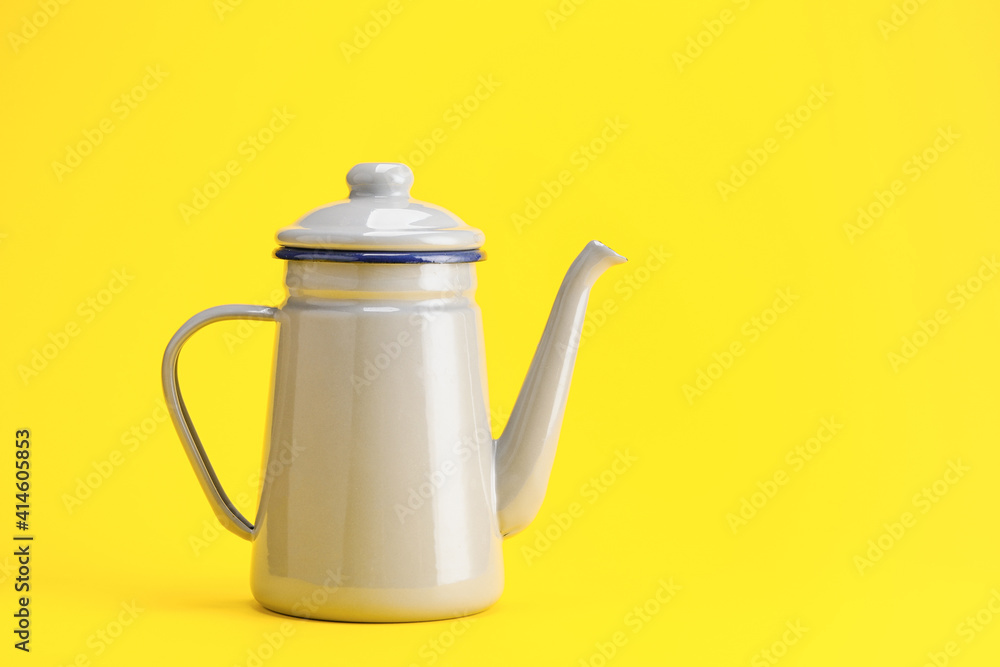 Stylish teapot on color background