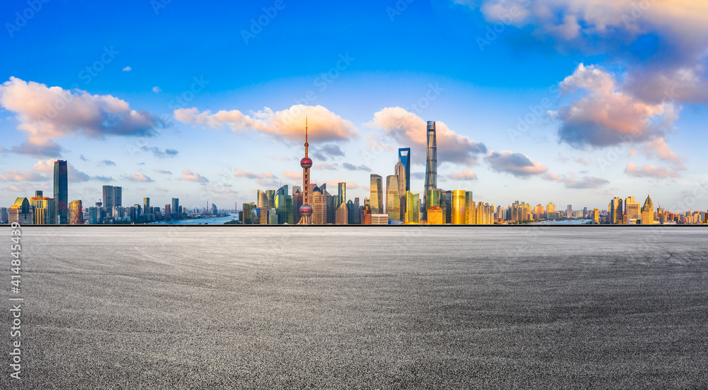 Race track road and Shanghai skyline with buildings at sunset.