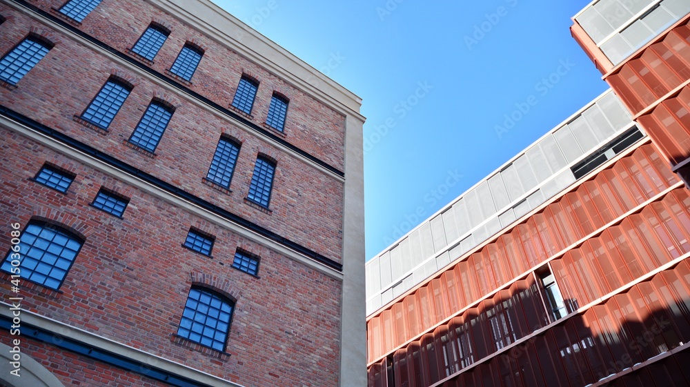 Revitalized red brick building and modern office building.