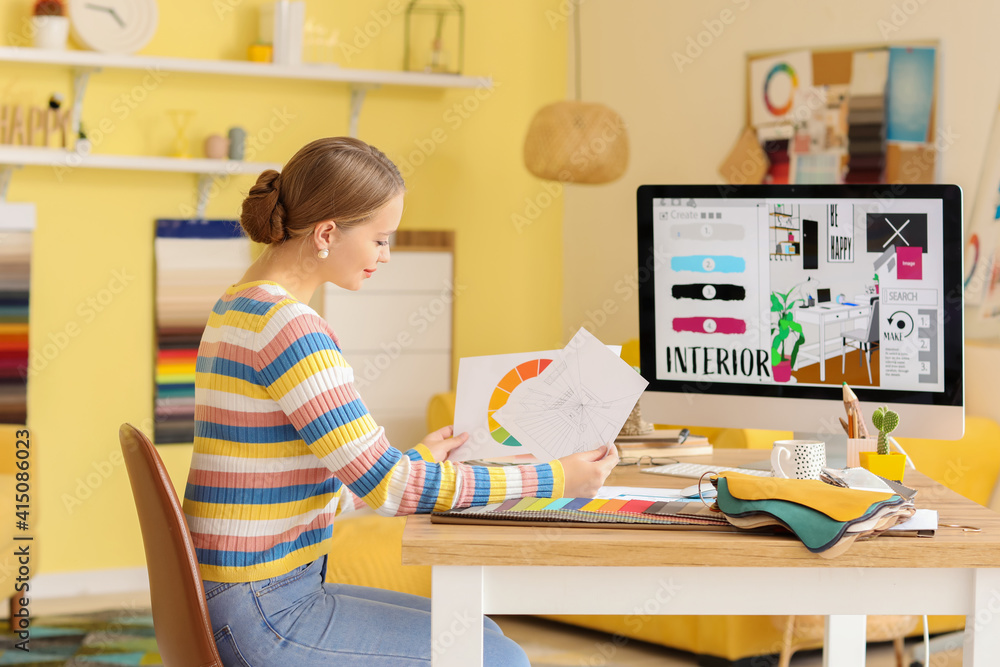 Female interior designer working in her office