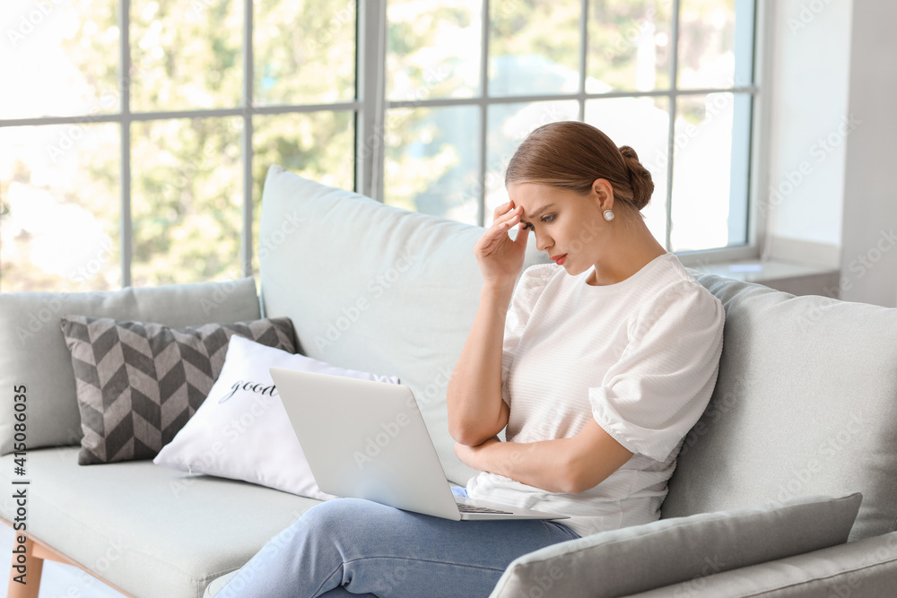 Stressed young woman asking psychologist for advice online at home