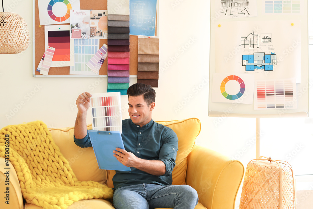 Male interior designer working in his office