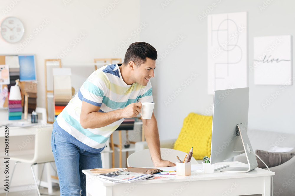 Male interior designer working in his office