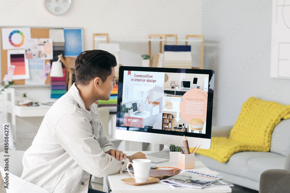 Male interior designer working in his office