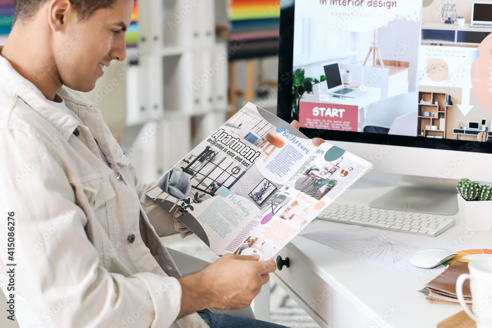 Male interior designer working in his office