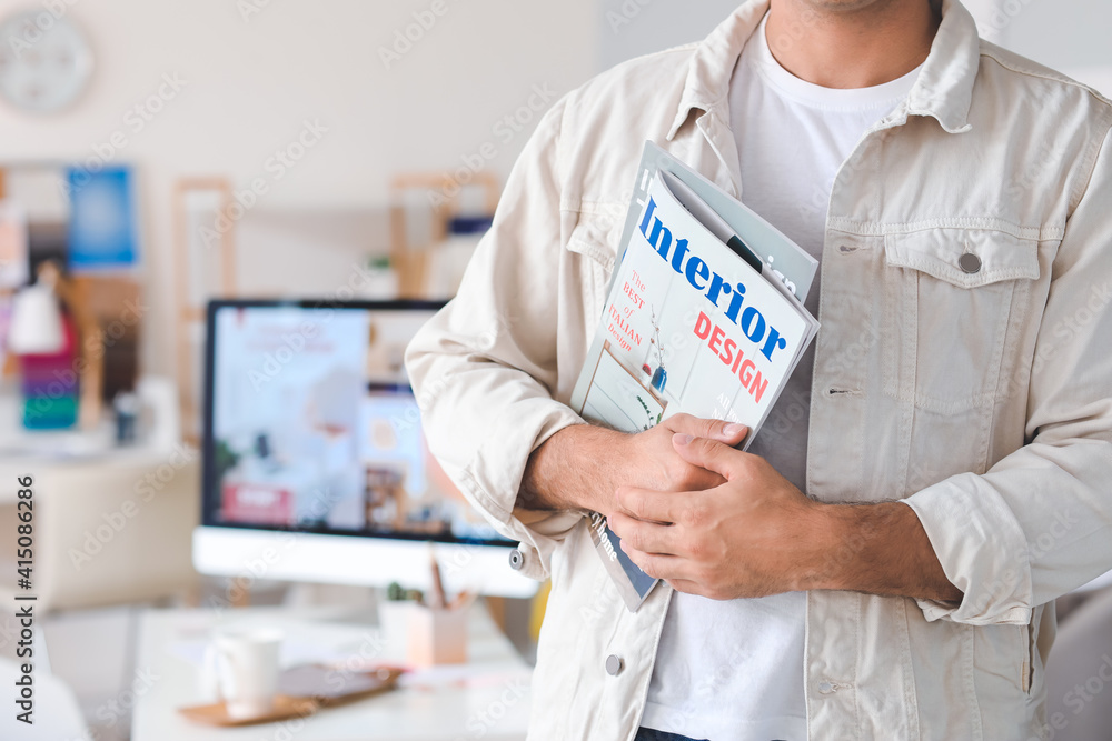 Male interior designer in his office