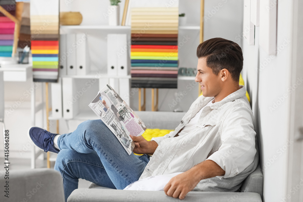 Male interior designer working in his office