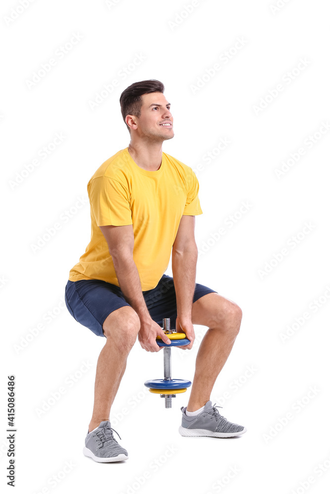 Sporty young man training with dumbbell on white background