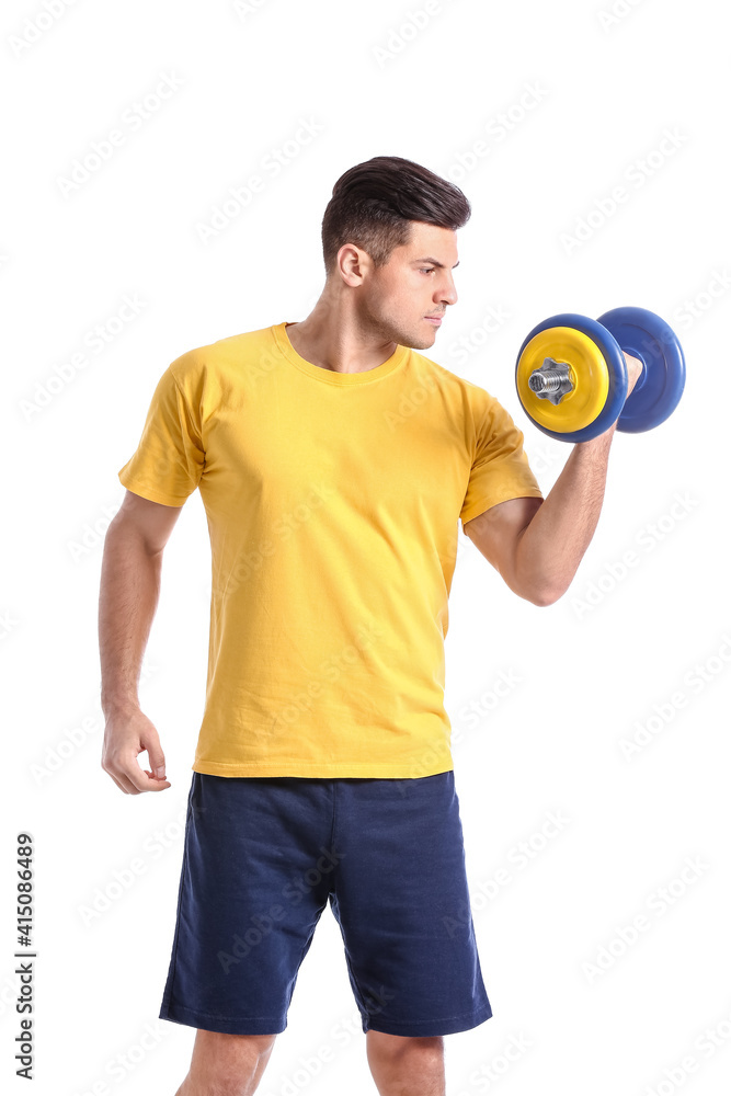 Sporty young man training with dumbbell on white background