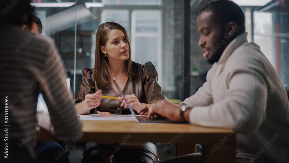 Young Creative Team Meeting with Business Partners in Conference Room Behind Glass Walls in Agency. 