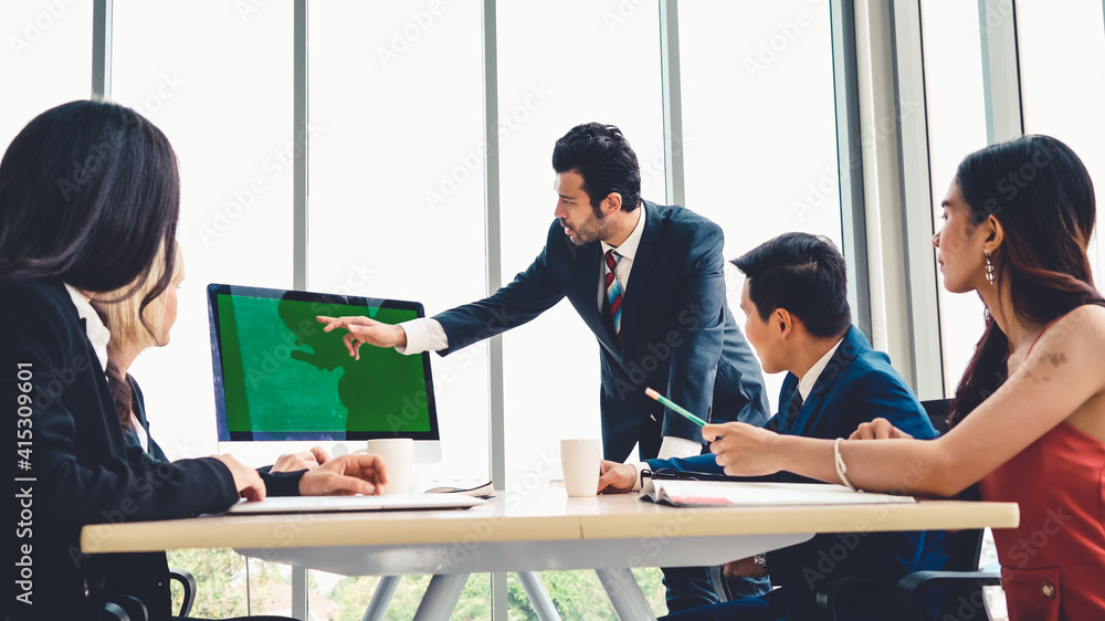 Business people in the conference room with green screen chroma key TV or computer on the office tab