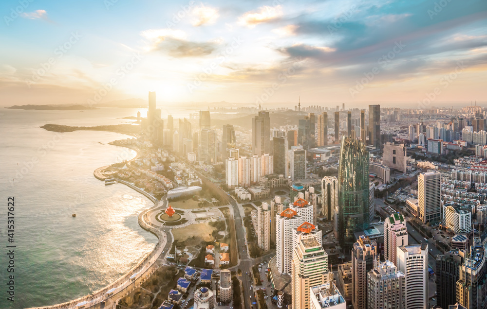 Aerial photography of Qingdao coastline buildings and clouds at dusk