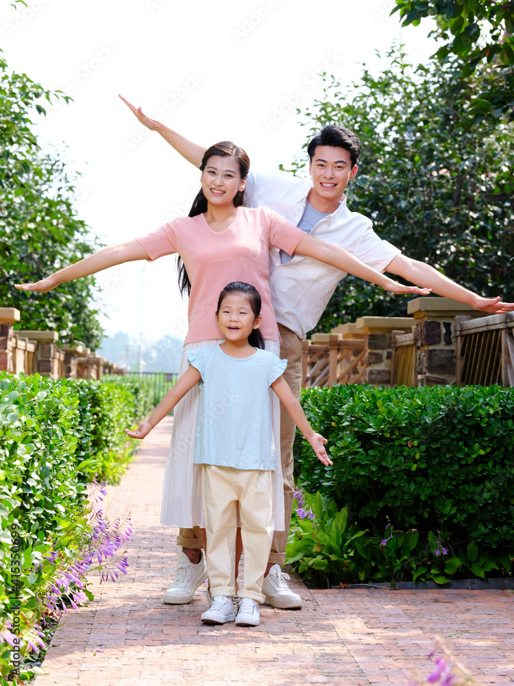 Happy family of three in the outdoor group photo