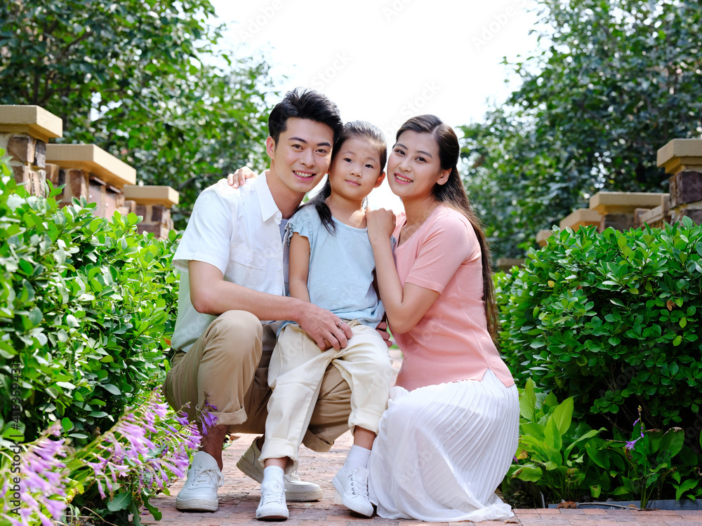 Happy family of three in the outdoor group photo