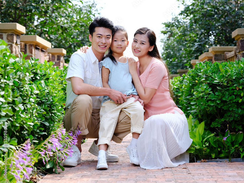 Happy family of three in the outdoor group photo