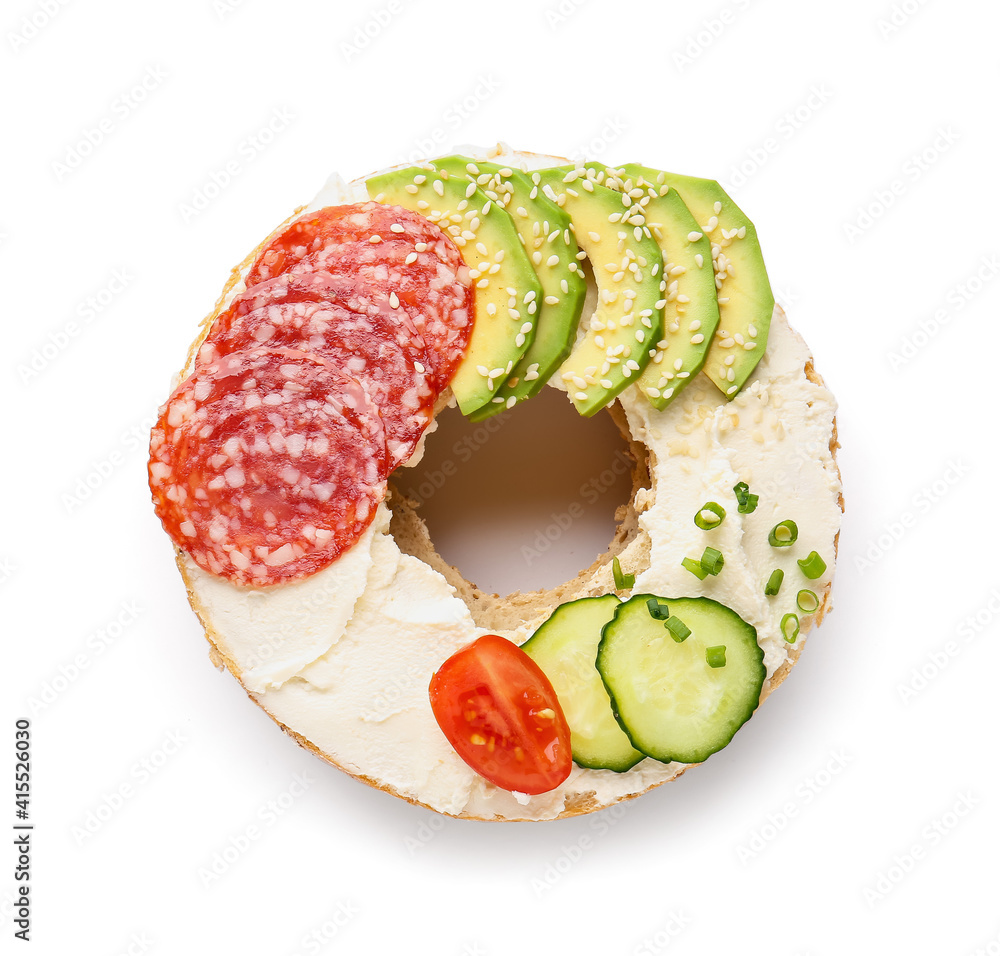 Fresh bagel with tasty cream cheese on white background