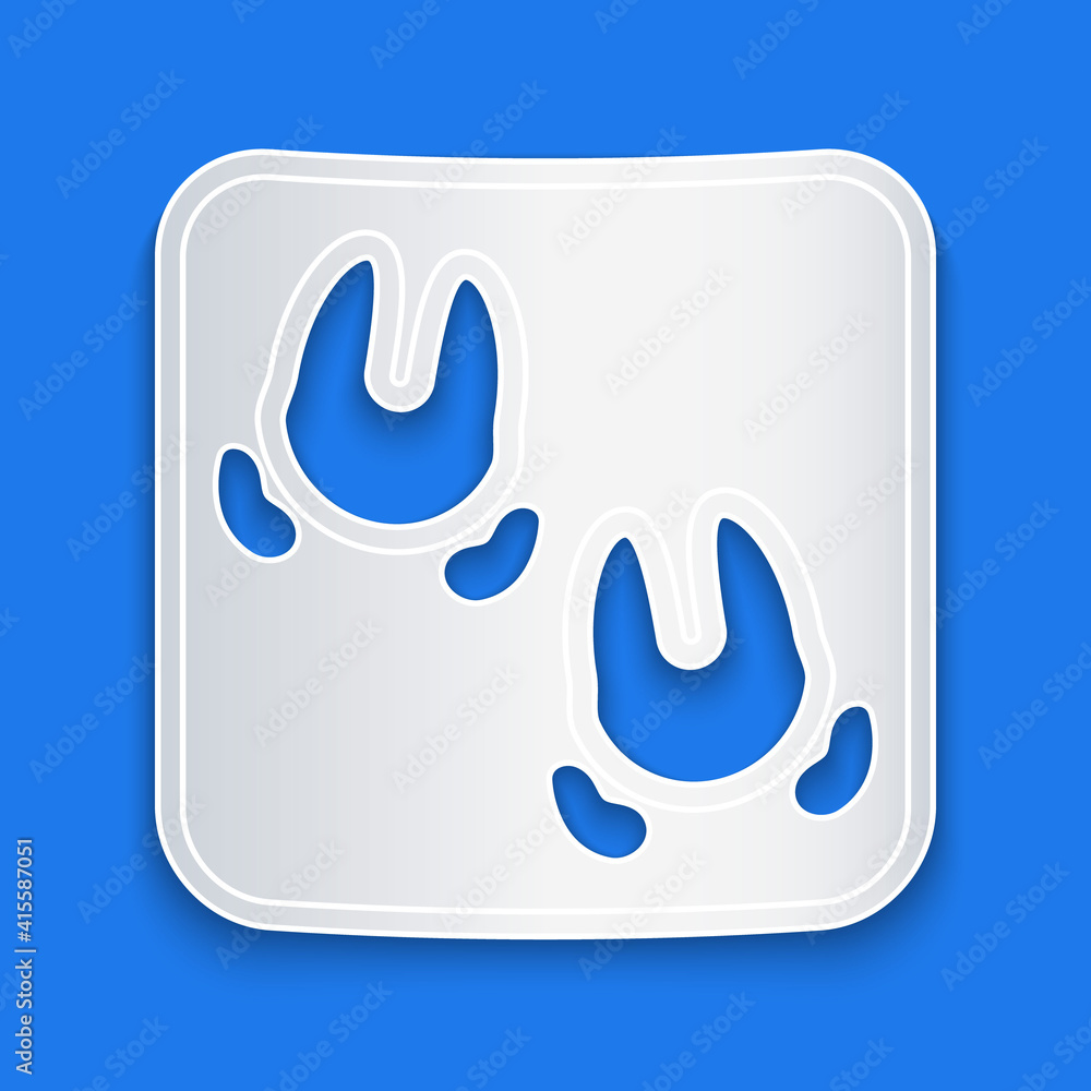 Paper cut Wild boar paw footprint icon isolated on blue background. Paper art style. Vector.