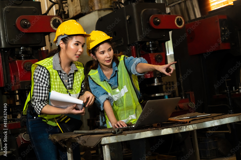 Factory job workers working and discussing manufacturing plan in the factory . Industry and engineer