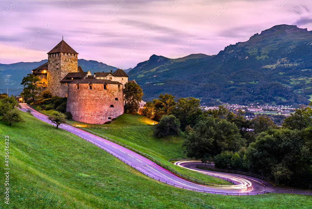 Vaduz Castle with a curvy road in Liechtenstein at sunset