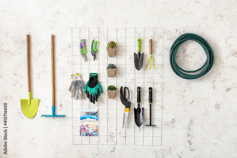 Set of gardening supplies and houseplants in barn