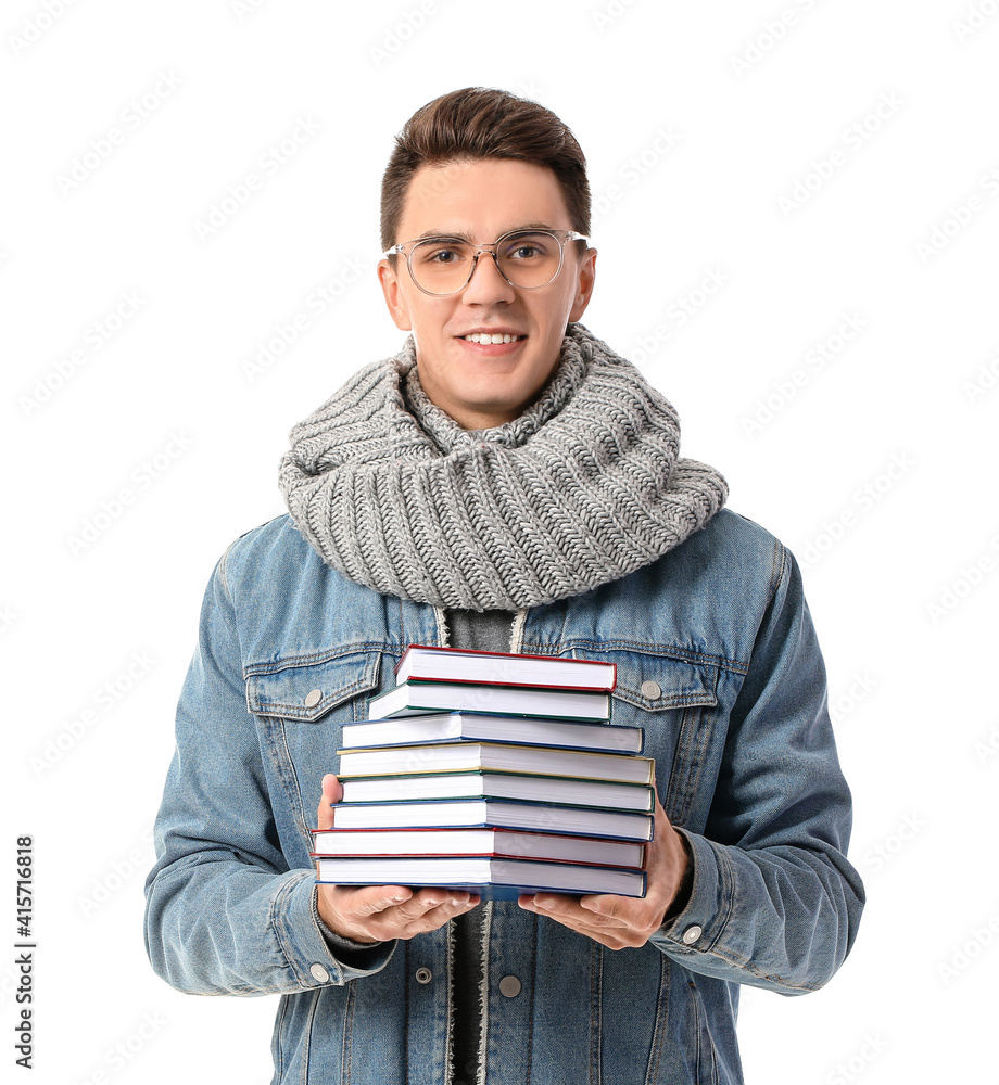 Young man with books on white background