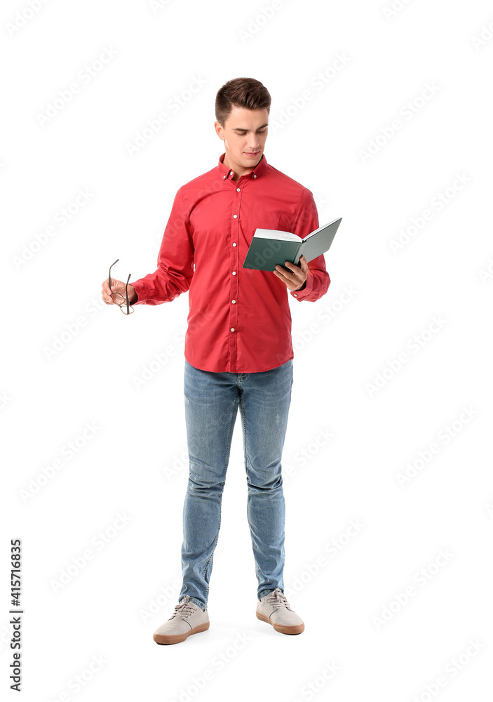 Young man reading book on white background