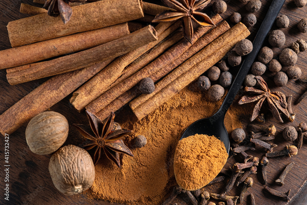 various spices on wooden board