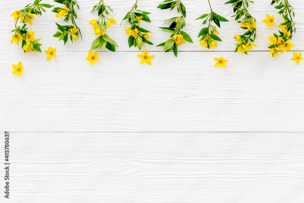 Floral pattern of yellow flowers with leaves, top view