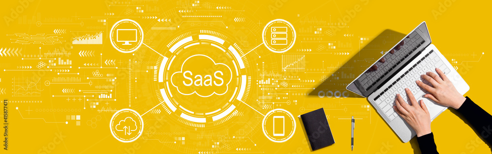 SaaS - software as a service concept with person working with a laptop