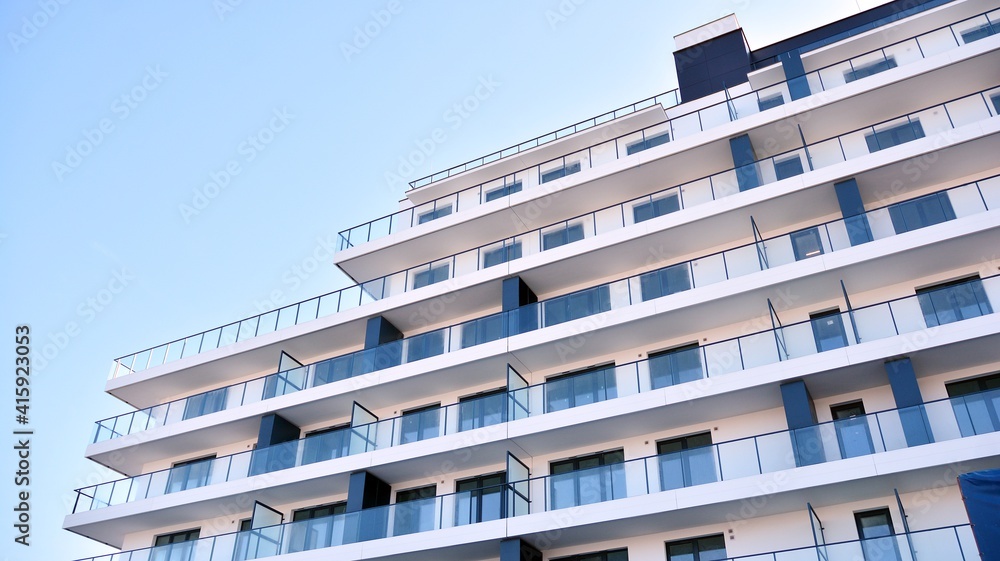 Condominium and apartment building with  symmetrical modern architecture in the city downtown.