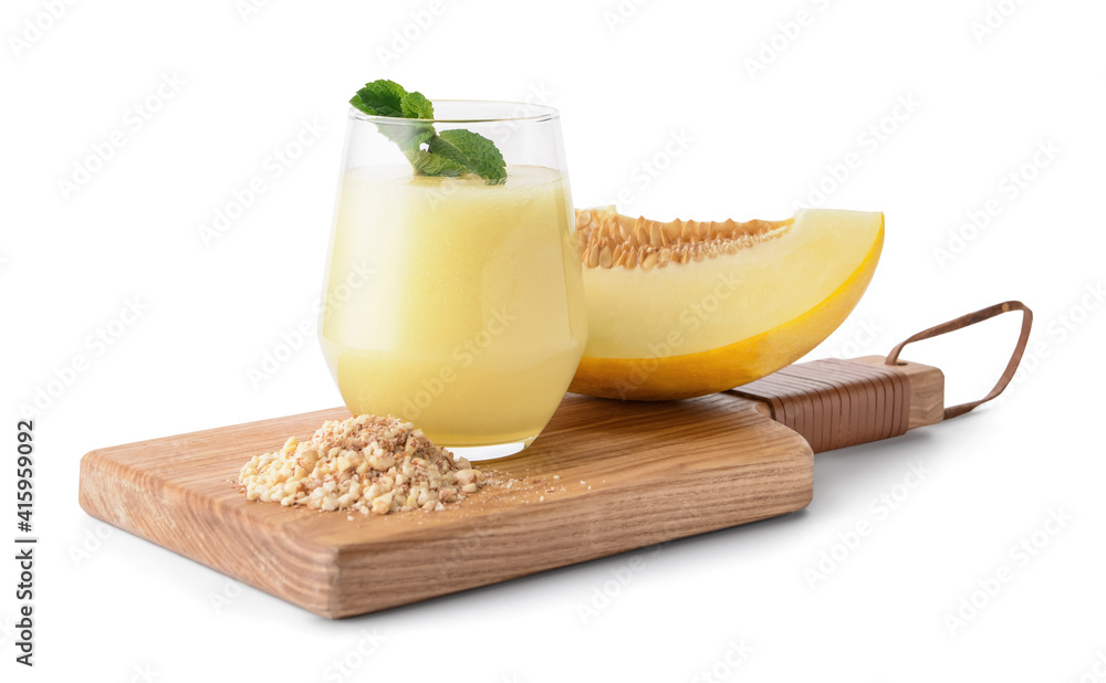 Board with glass of melon smoothie on white background