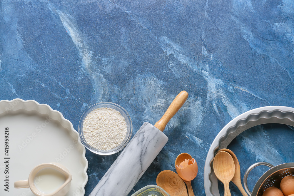 Set of kitchen utensils and ingredients for preparing bakery on color background