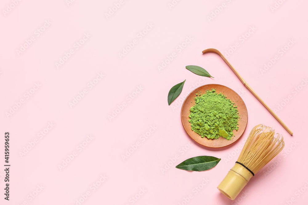 Plate with powdered matcha tea, chashaku and chasen on color background