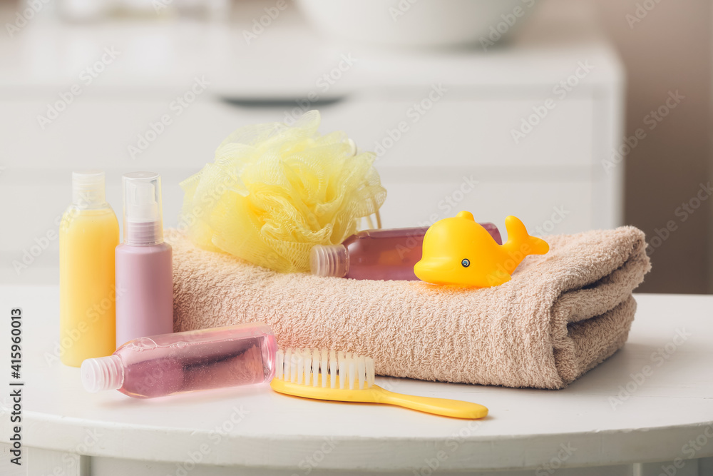 Bath accessories for baby on table in bathroom