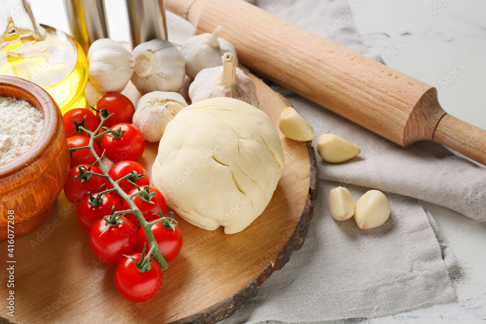 Ingredients for pizza on light background