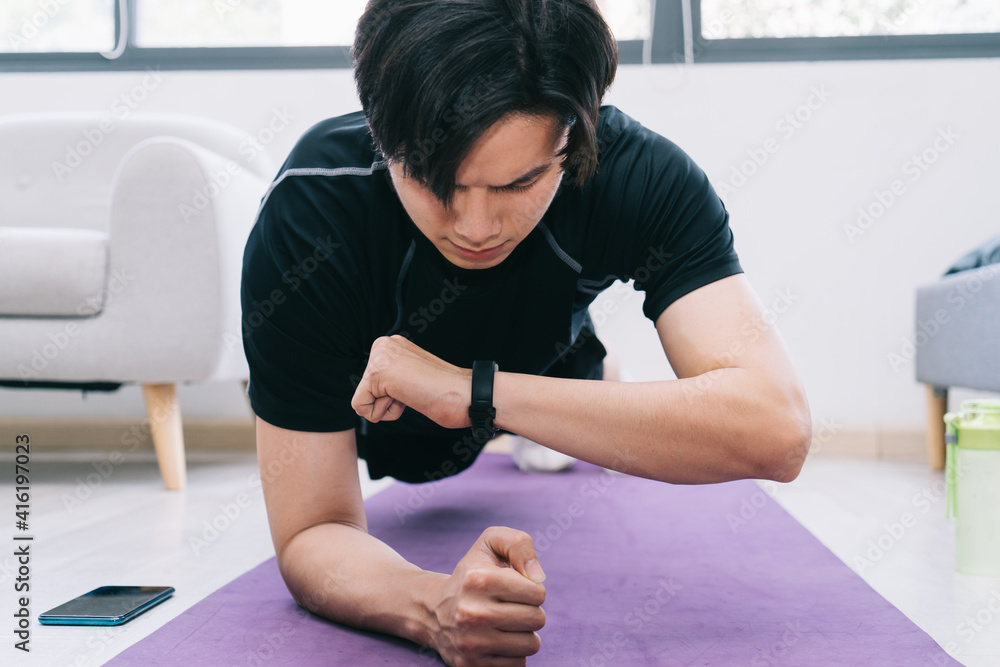 Young Asian man exercising at home