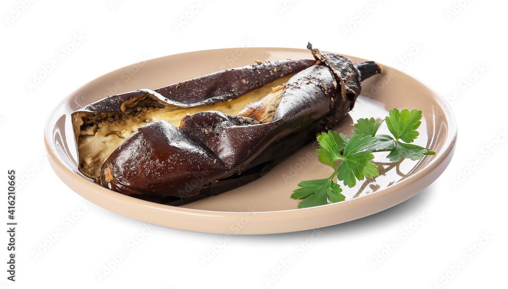 Plate with tasty baked eggplant on white background