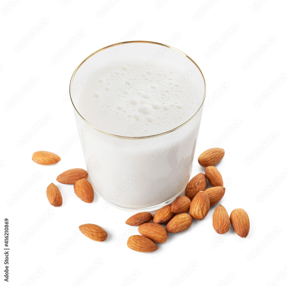 Glass of tasty almond milk on white background