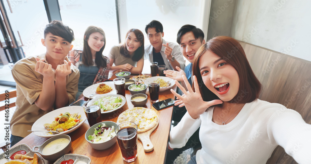 friends take selfie in restaurant