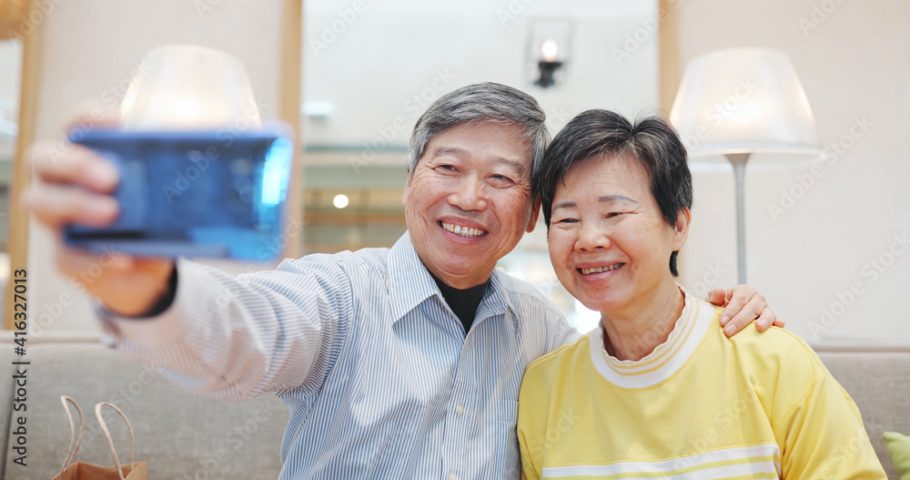 elder couple take selfie