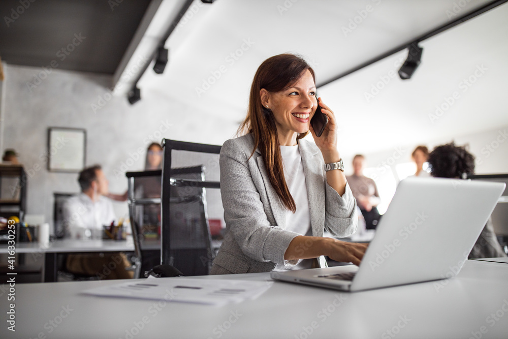 Portrait of business woman, using modern technology.